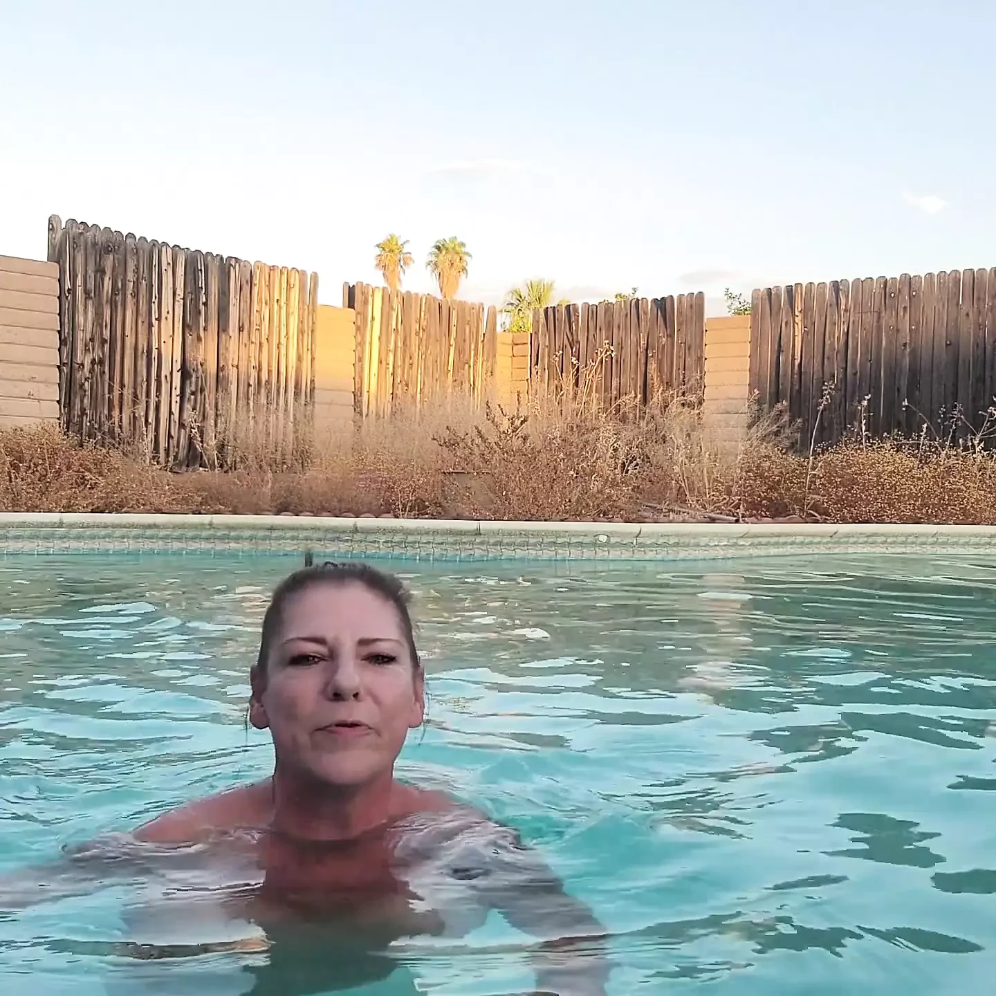 Is Naked MILF Smoking in Swimming Pool