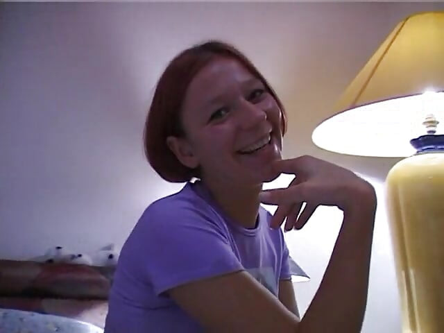 Redhead girl rubs and fingers her wet twat