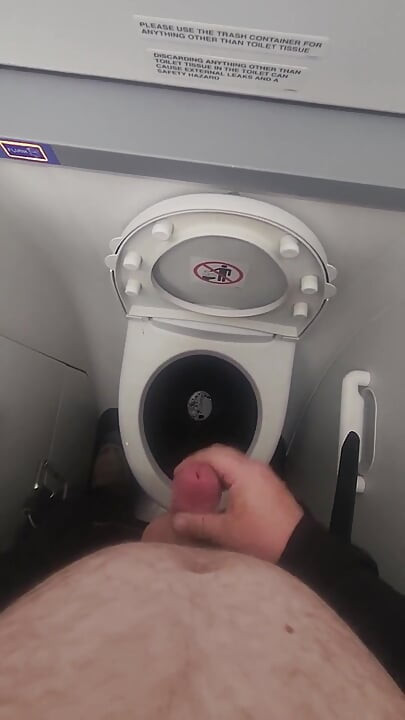 Airplane Bathroom Jerk and Cum.