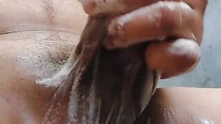 Indian guy is washing his big cock on bathroom