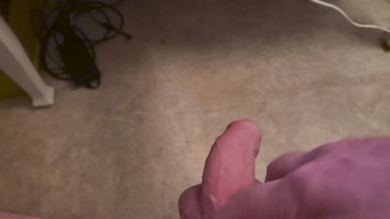 My Friend Sits in a Chair and Jerks off His Cock While Watching Video