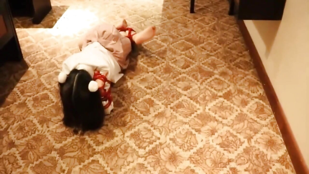 A Cute Little Dressed in a Jk Uniform Was Walking Around Barefoot on the Ground.