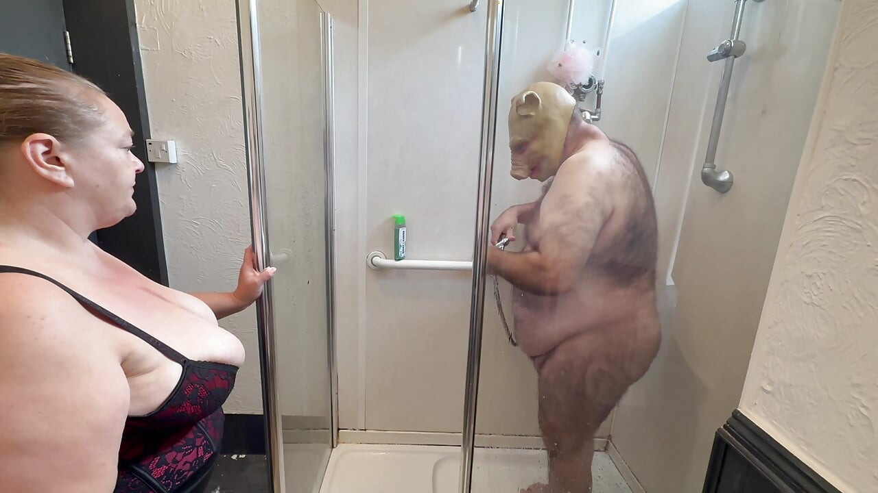 Domina Satana and Satana's piggy in the shower.