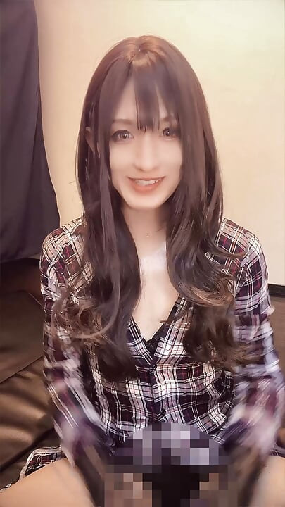 A video of a casual black-haired crossdresser quietly masturbating