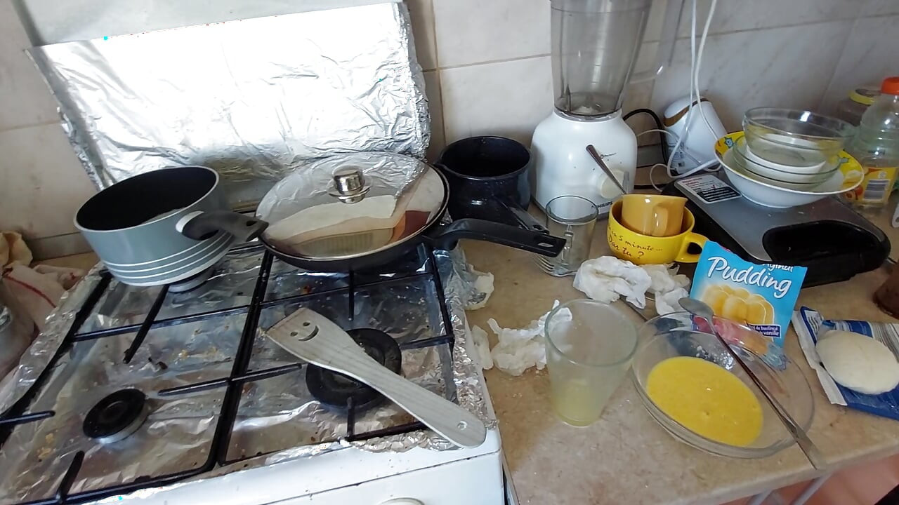 Sexy wife prepares breakfast naked in the kitchen.