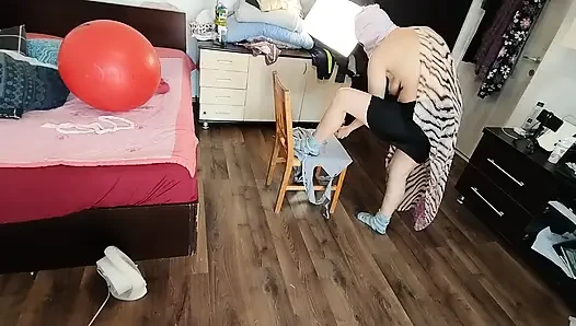 Sexy brunette doing naked chores around the house.