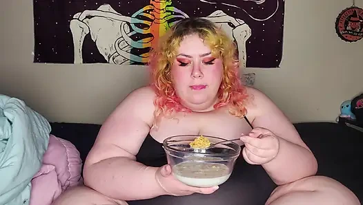 Fat woman eating frosted flakes