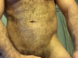 Sexy hairy muscle hunk jerks off.