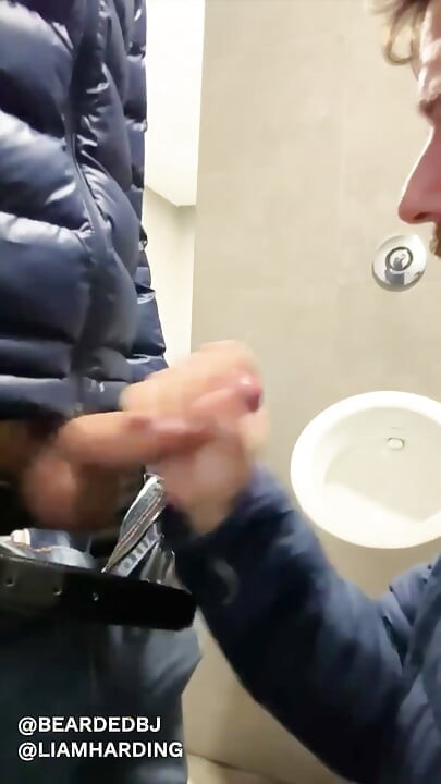 hot daddy with big cock gets sucked in public bathroom by sexy bear