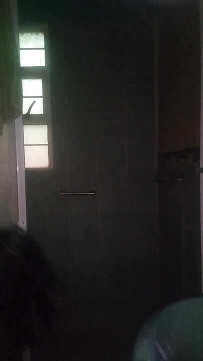Man Showering with Flashlight On