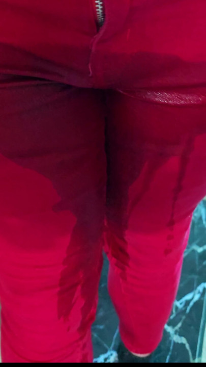 Red skinny jeans, black socks, black rug