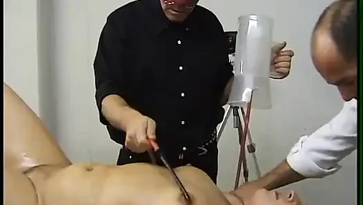 Mature blonde gets fisted and whipped by dominating males