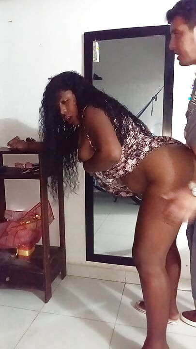 My neighbor welcomes me in a mini dress