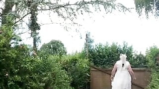 In an outfit with a long white dress for an evening.