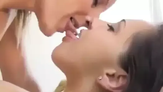 Hot sensual emotional passionate lesbian kissing close up