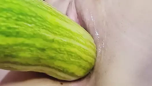 Naughty teen cumming and breaking into her pussy with big vegetable