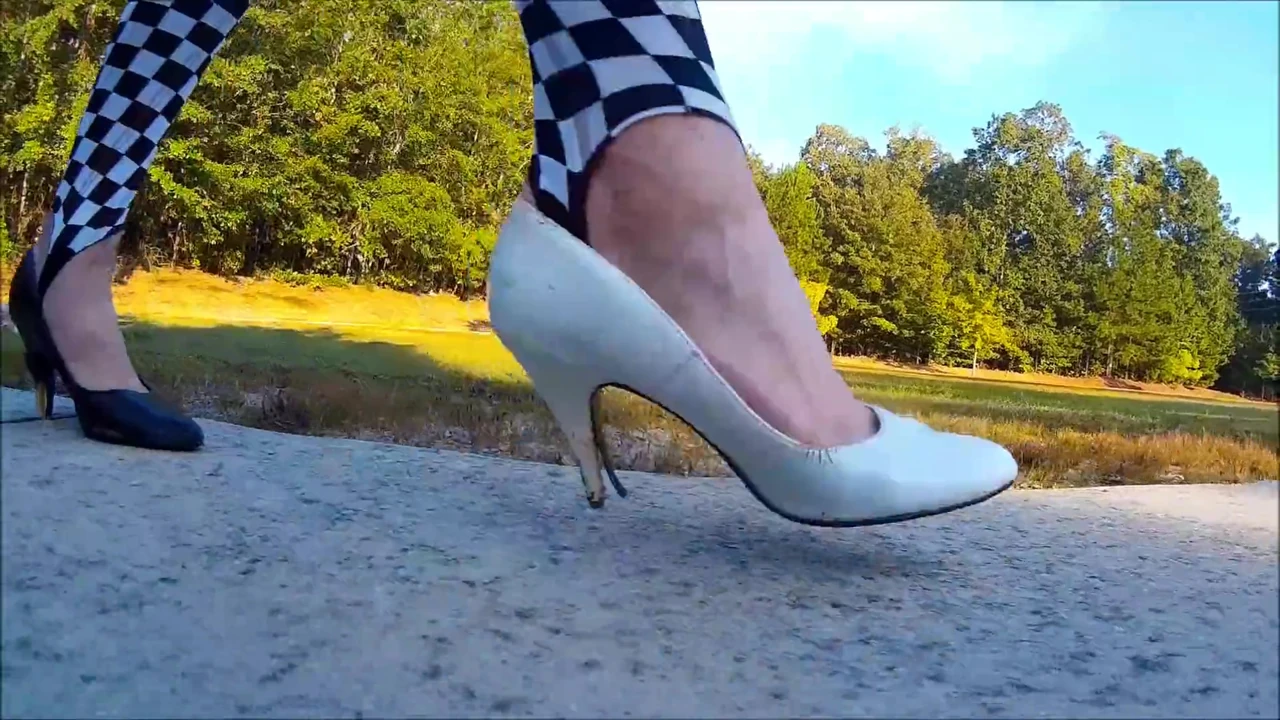 Crossdresser Walking in a public park in high heels