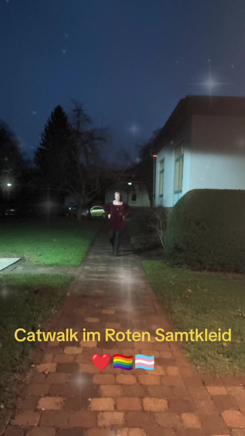 Catwalk in red velvet dress.