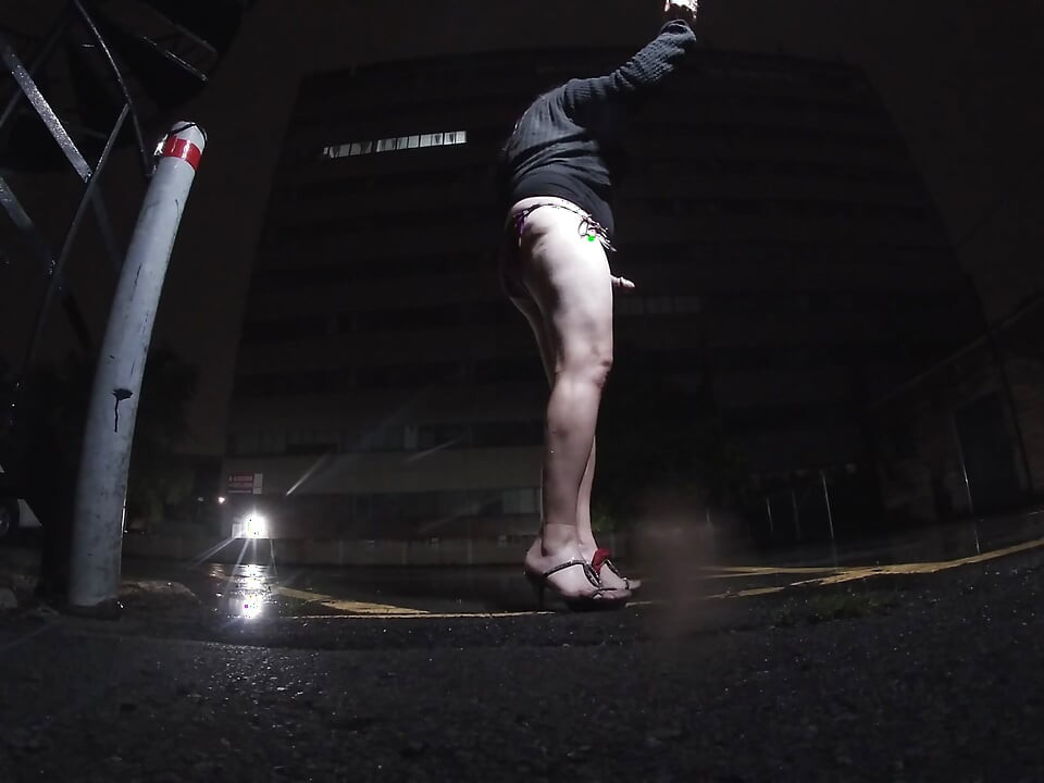 Mature sissy CD out in the rain in A parking lot in public masturbation.