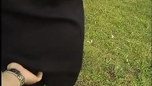 Lovely mature lady blows a guy's cock outdoors near the car