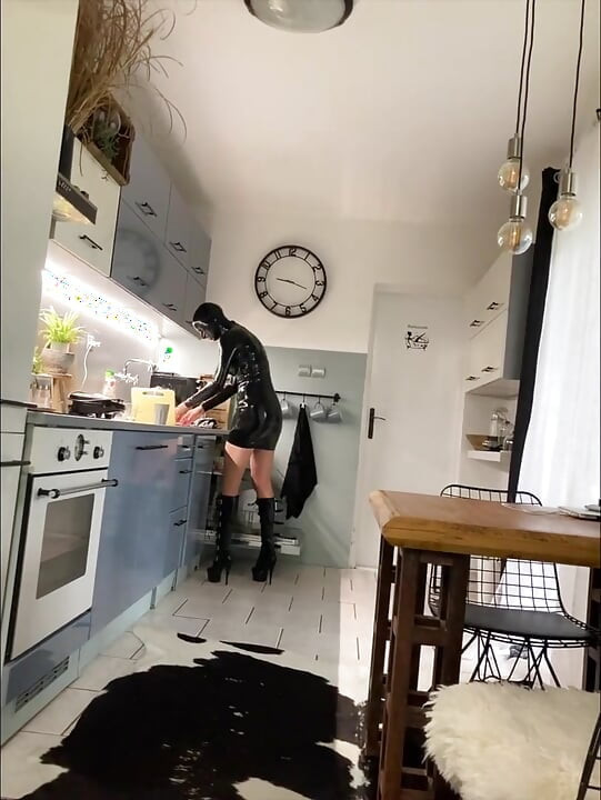Latex maid service in high heels and chains