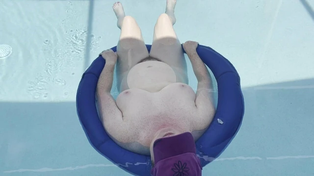 BBW floating naked in the pool