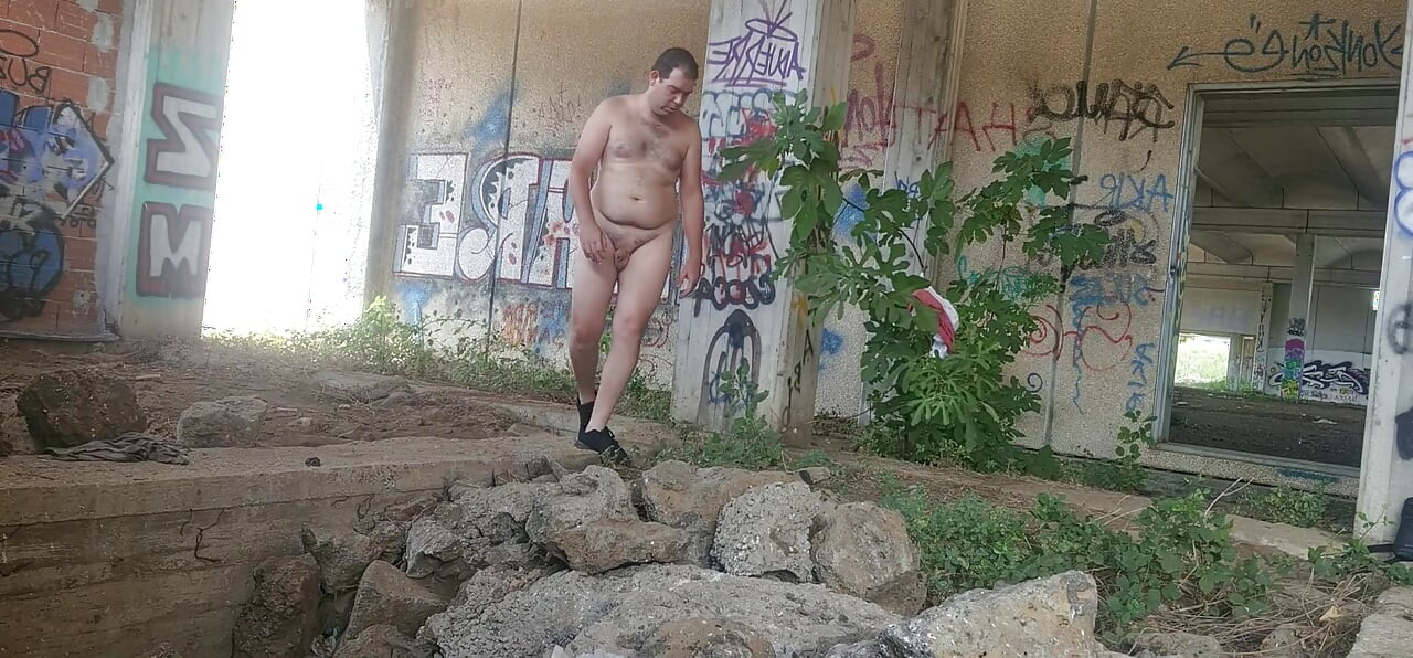 Naked boy in an abandoned building