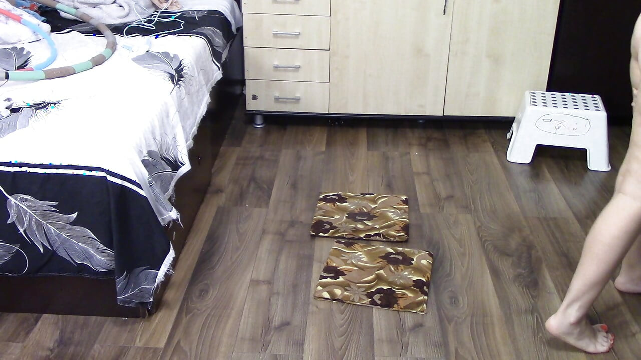 Amateur woman has fun trying on clothes and cutting them. Amateur woman vacuums naked in the house.