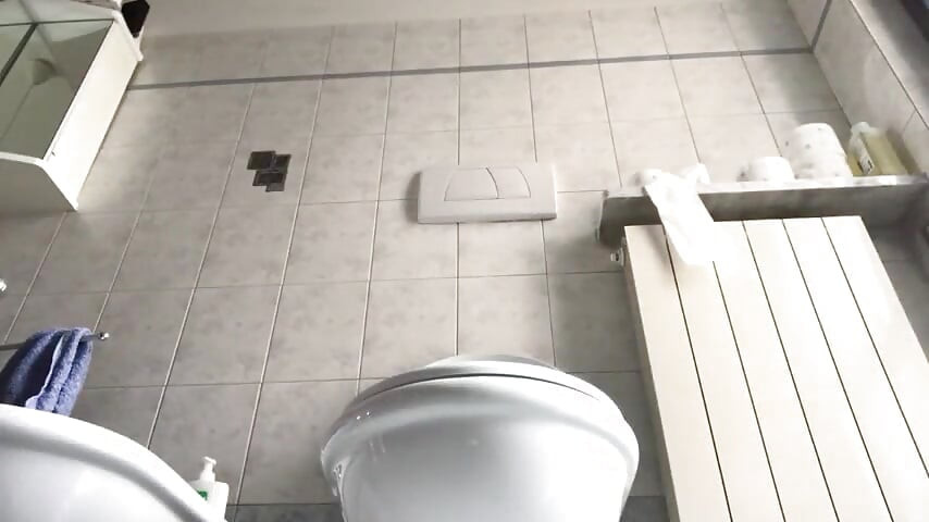 Sexy mistress shows her foot in close up in the bathroom