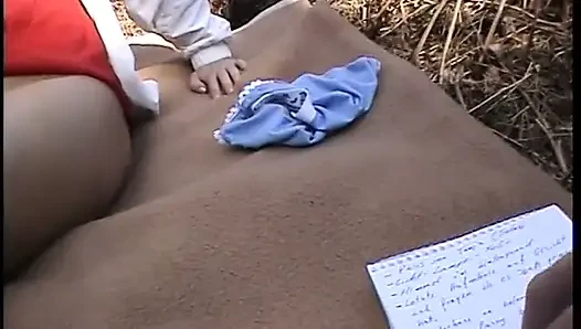 Redhead chick plays with her pussy outdoors