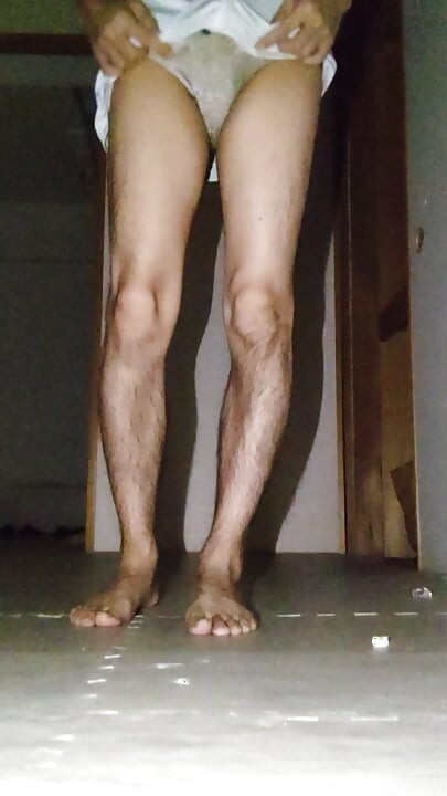 A Japanese woman in crossdressing masturbates