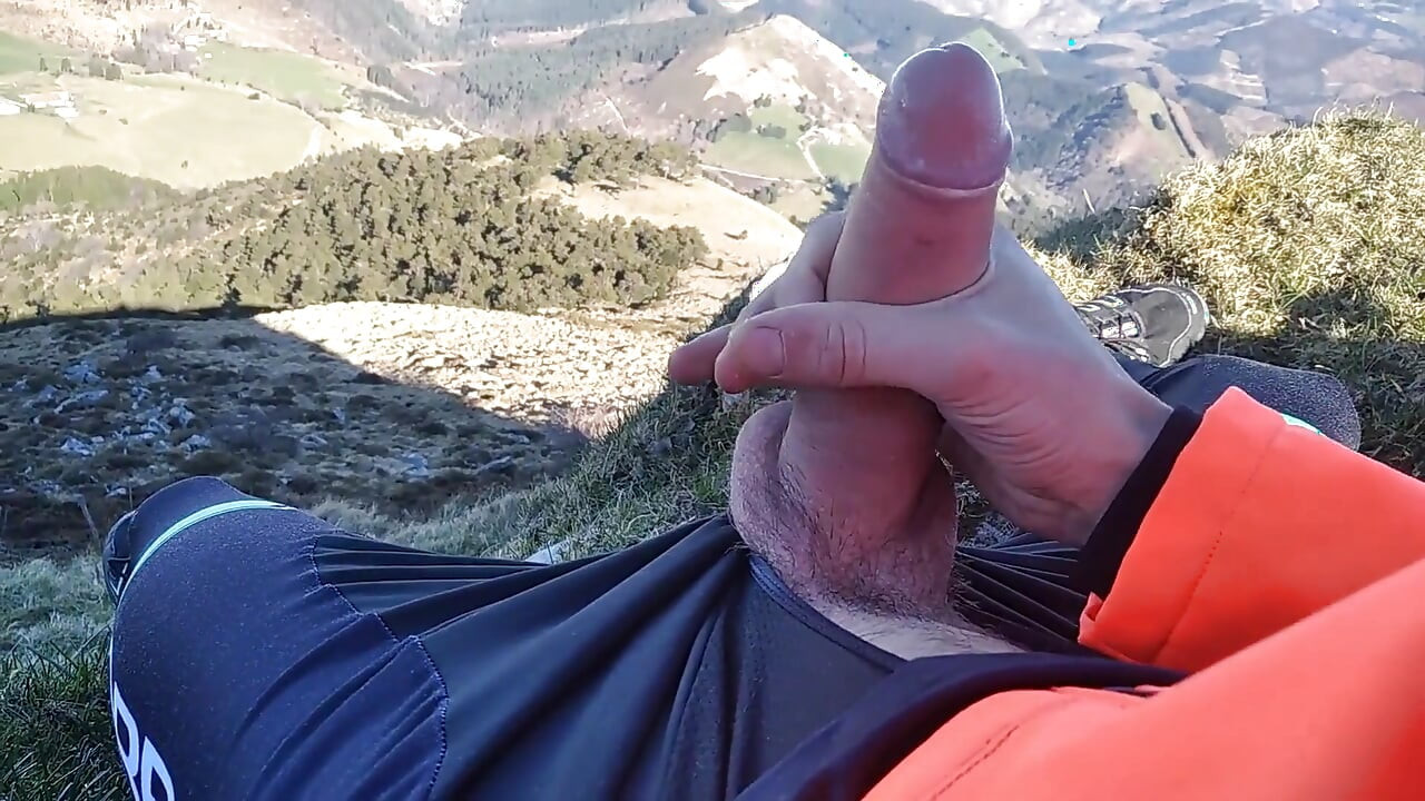 Jock in Fishnet Jerks His Big Fat Cock and Cums on Top of the Mountain