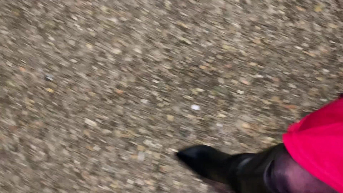 Crossdresser in high heel boots out walking