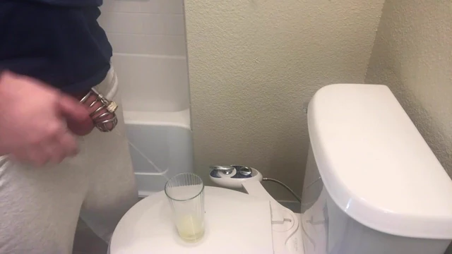 Chastity sub drinks his morning piss