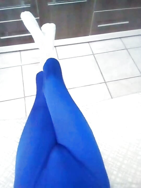 Fun at home wearing a blue Zentai costume with socks
