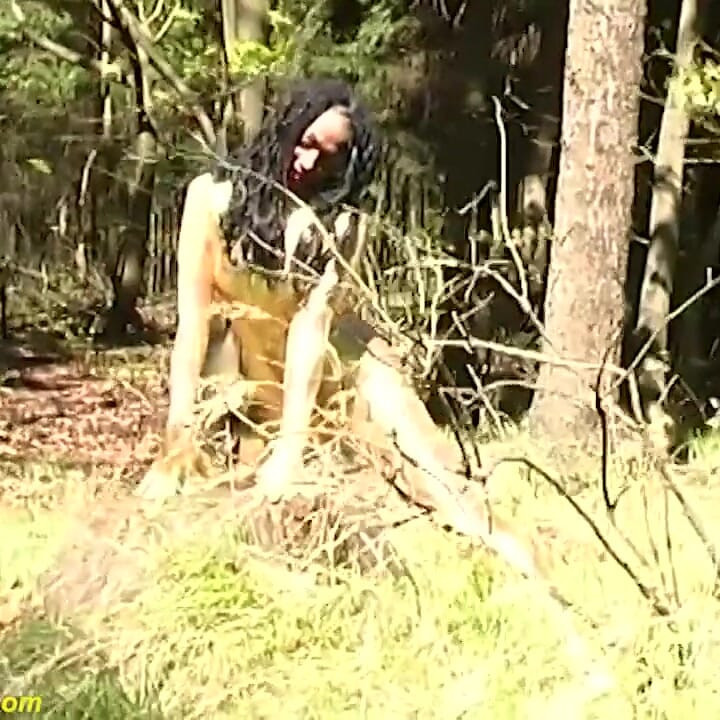 Sexy ebony babe in skintight golden spandex catsuit posing outdoor