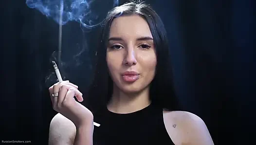 Elegant Brunette Smoking in Black Outfit