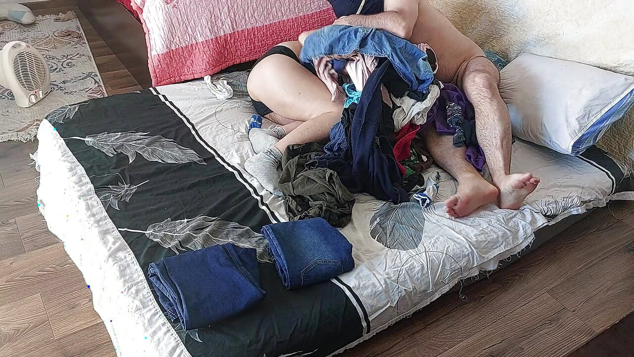 Foreplay in the bedroom with an amateur couple.