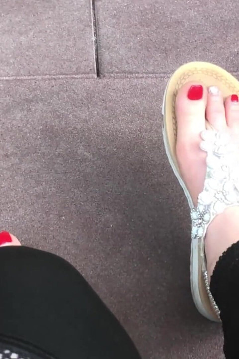 Sandals teasing outdoor with red toenails & toes wiggling