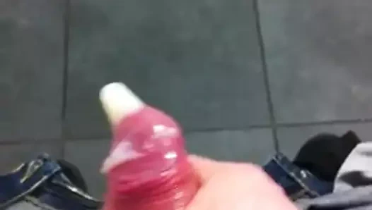 Cum filling a condom in a public bathroom
