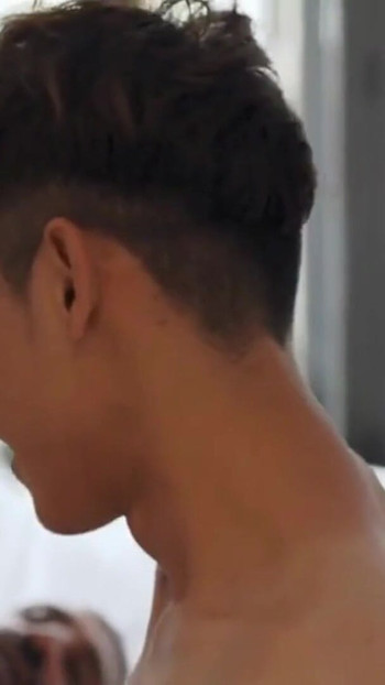 Key moment from "Muscle Daddy Breeds Cute Asian Twink Bareback"