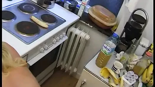Pregnant babe bends over the counter as she gets fucked to a cumshot