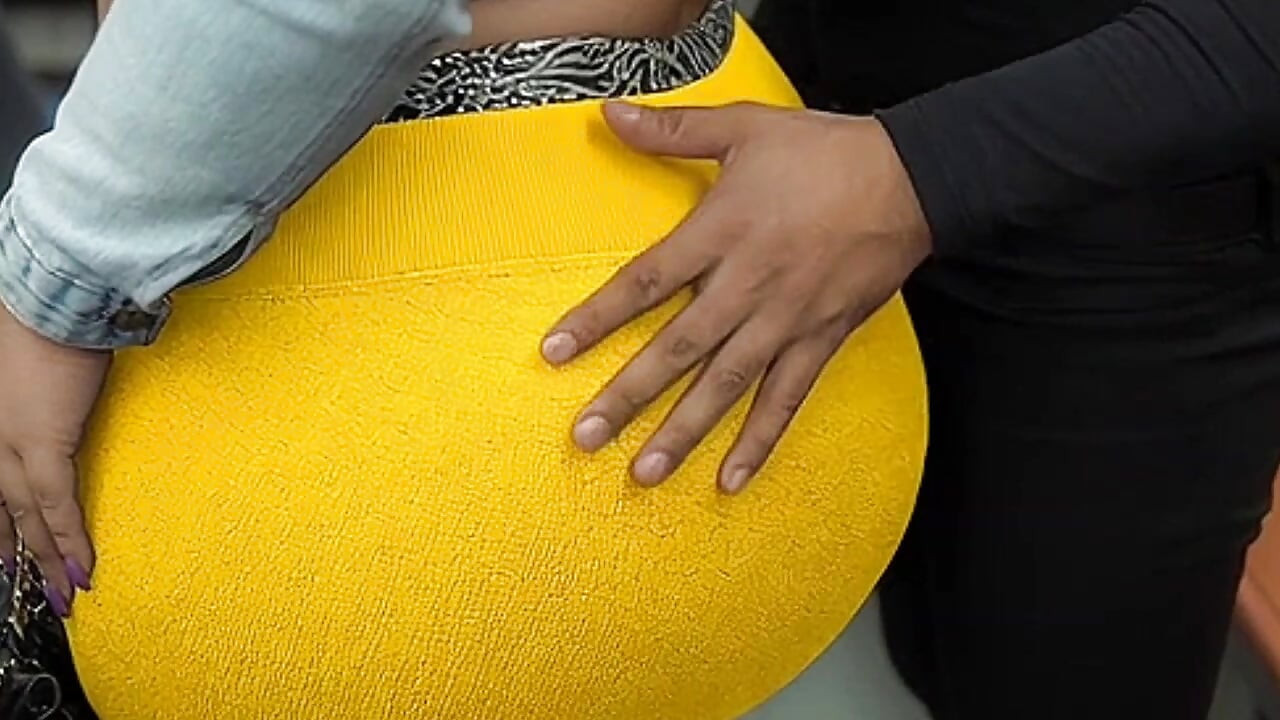 "Masked BBW Teases Huge Ass in Shiny Yellow Leggings on Public Bus"