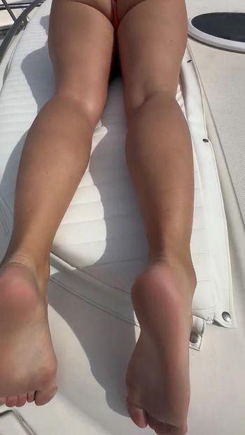 sunbathing on the bow of the boat