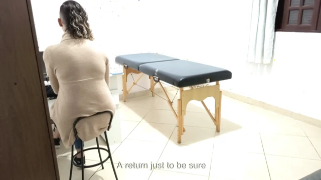 Proctologist performs anal exam on constipated patient.