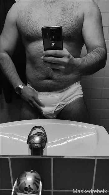 Hot guy in tighty whities pulls out his big soft cock in the office restroom