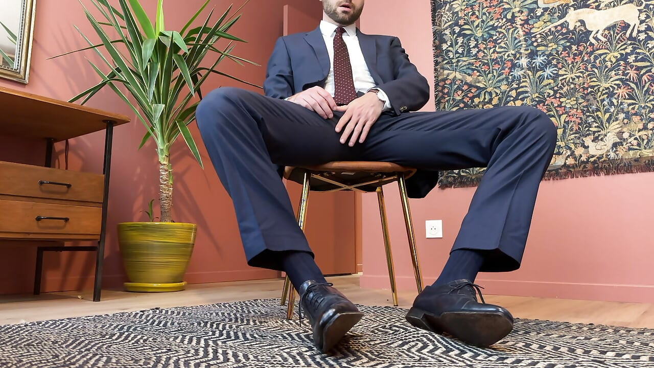Jerking off at the office in a suit and tie