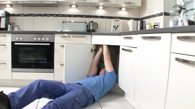 Busty German housewife rides dick in the kitchen