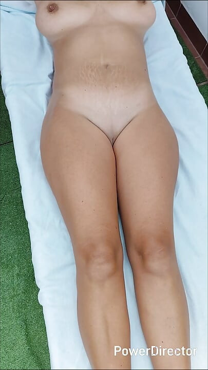 Sexy milf with big natural tits sunbathes nude and shows off her body