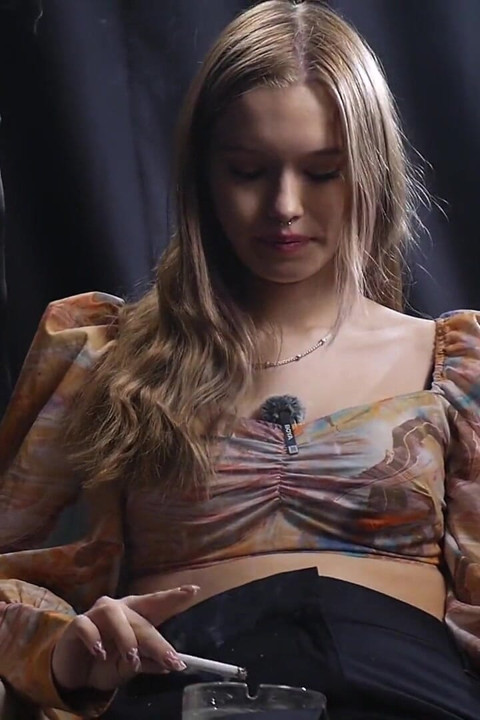Sweet Russian Blonde Smoking in Colorful Blouse